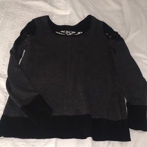 Maurice’s black and grey shirt